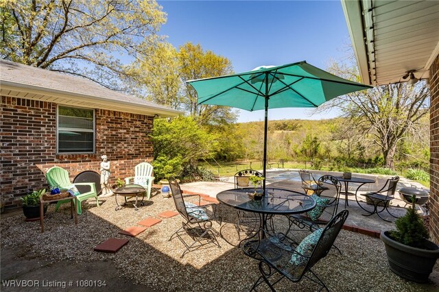 3032 King Dr, Mulberry, AR 72947 - view of patio / terrace featuring outdoor dining area