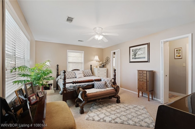3032 King Dr, Mulberry, AR 72947 - carpeted bedroom with baseboards, a ceiling fan, and visible vents
