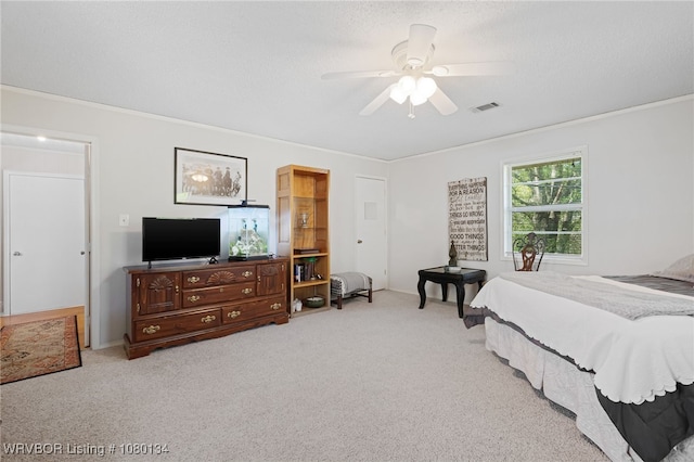 3032 King Dr, Mulberry, AR 72947 - bedroom with visible vents, a ceiling fan, carpet, a textured ceiling, and crown molding