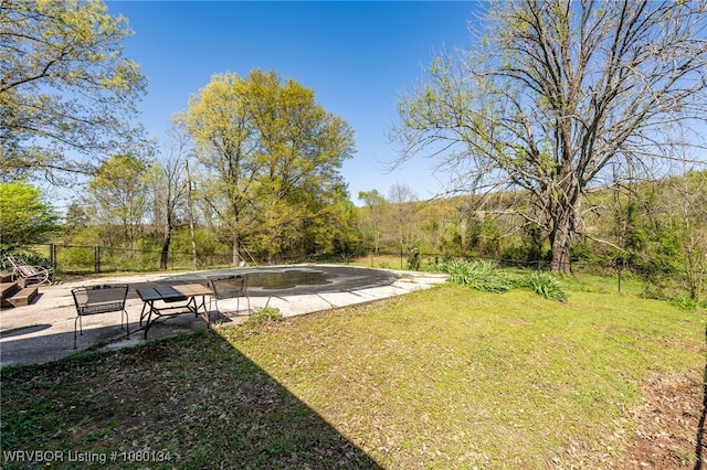 3032 King Dr, Mulberry, AR 72947 - view of yard featuring a patio area, fence, and a forest view