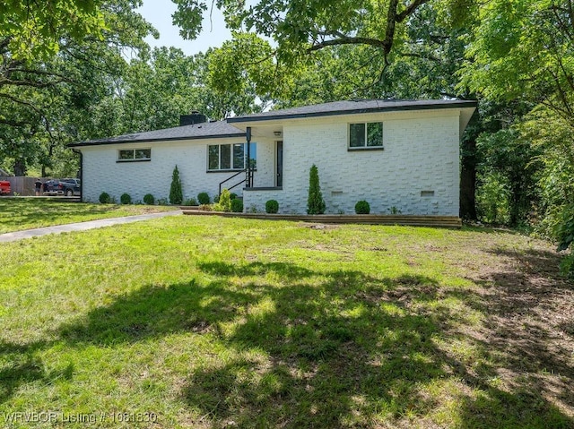 2420 Independence St, Fort Smith, AR 72901 - view of front of property with brick siding, a front yard, and a chimney