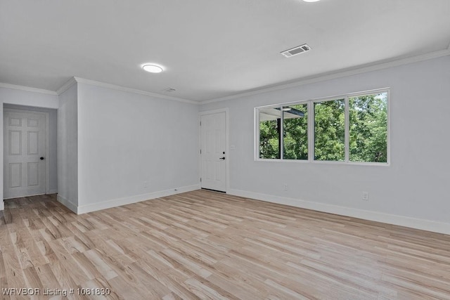 2420 Independence St, Fort Smith, AR 72901 - empty room featuring light wood-style flooring and crown molding