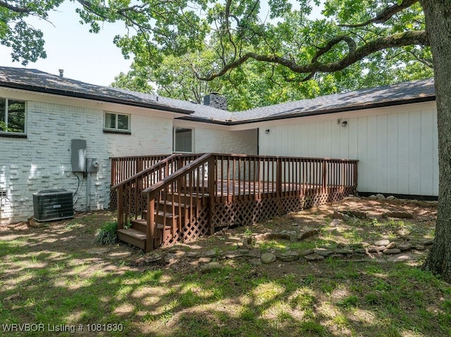 2420 Independence St, Fort Smith, AR 72901 - back of house with a wooden deck, a chimney, and brick siding