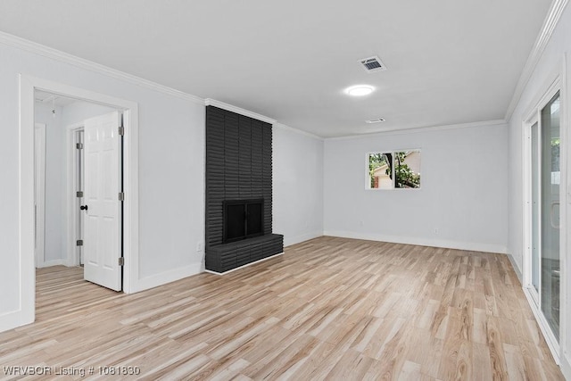 2420 Independence St, Fort Smith, AR 72901 - unfurnished living room featuring light wood-style floors, a fireplace, and crown molding