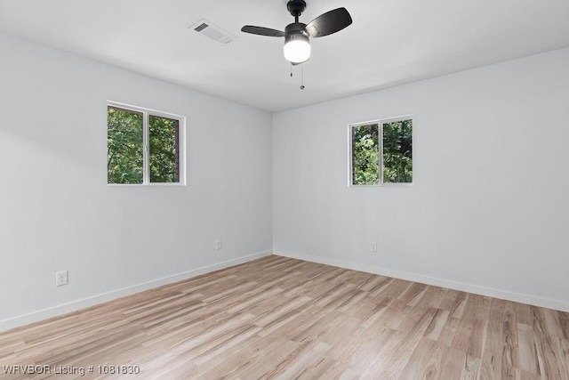 2420 Independence St, Fort Smith, AR 72901 - spare room with healthy amount of natural light, light wood-type flooring, and ceiling fan