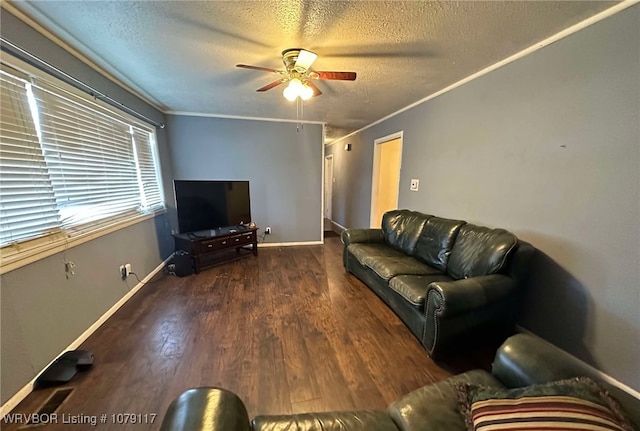 living area with crown molding, dark wood finished floors, a textured ceiling, and a ceiling fan