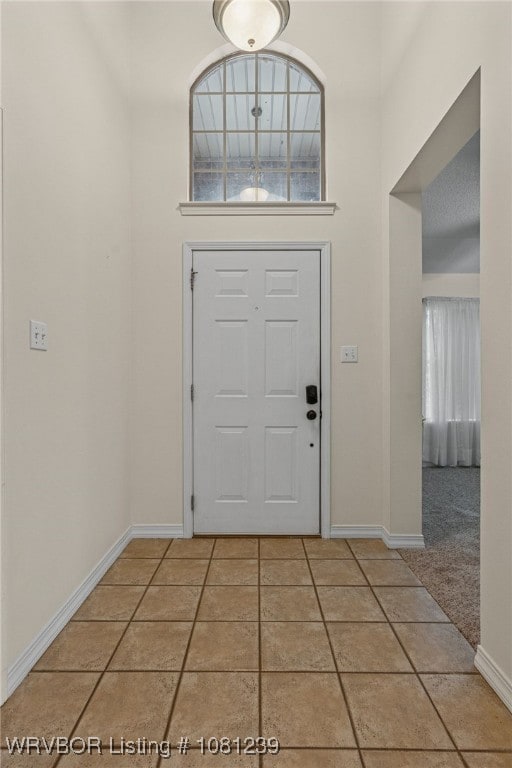 330 Northridge Dr, Van Buren, AR 72956 - foyer featuring baseboards, plenty of natural light, light tile patterned floors, and a high ceiling