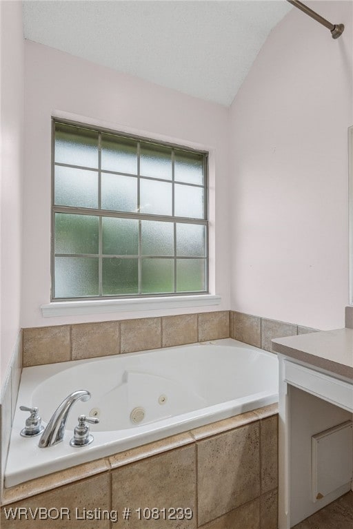 330 Northridge Dr, Van Buren, AR 72956 - bathroom with a whirlpool tub, vanity, and lofted ceiling