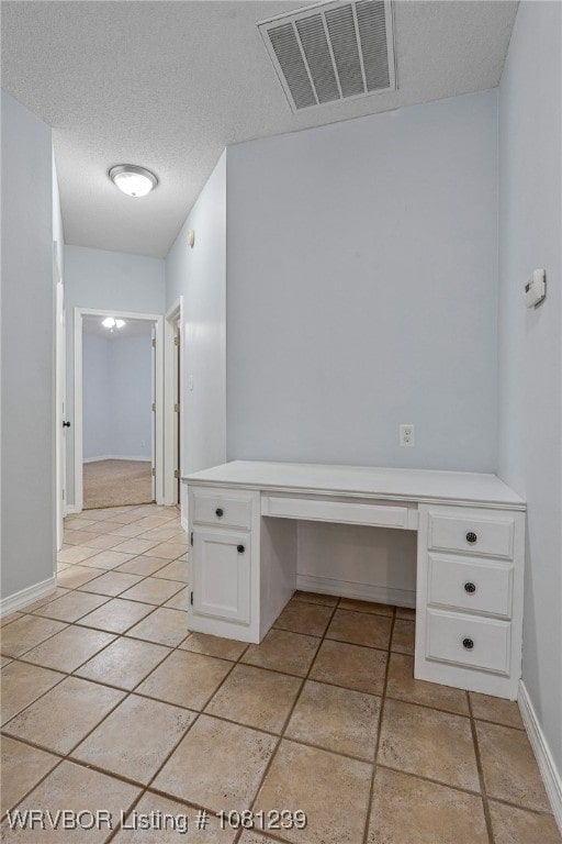 330 Northridge Dr, Van Buren, AR 72956 - unfurnished office with built in study area, light tile patterned floors, baseboards, and a textured ceiling
