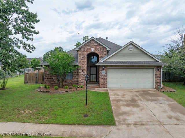 330 Northridge Dr, Van Buren, AR 72956 - traditional-style home with brick siding, an attached garage, driveway, and roof with shingles