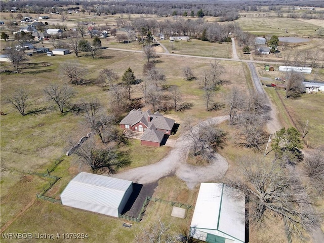 birds eye view of property with a rural view