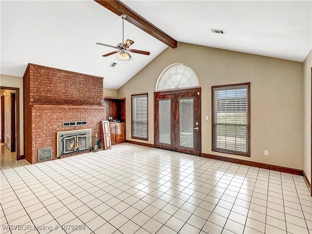 unfurnished living room with beam ceiling, light tile patterned flooring, visible vents, and a brick fireplace