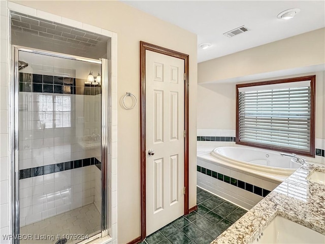 full bathroom featuring a shower stall, visible vents, a bath, and tile patterned floors