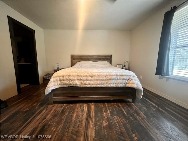 bedroom featuring dark hardwood / wood-style flooring