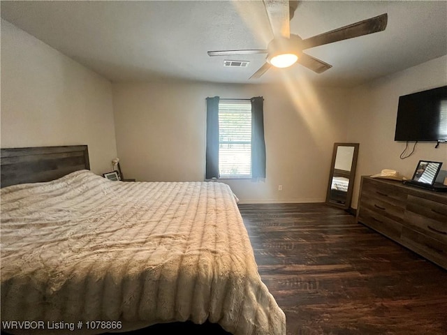 bedroom featuring dark hardwood / wood-style flooring and ceiling fan