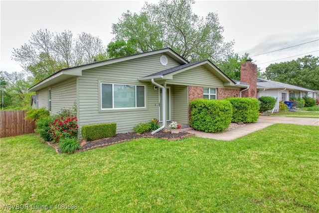 single story home featuring fence and a front yard