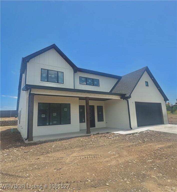 7005 Alianna Way, Fort Smith, AR 72916 - view of front of house with concrete driveway, a garage, and a porch