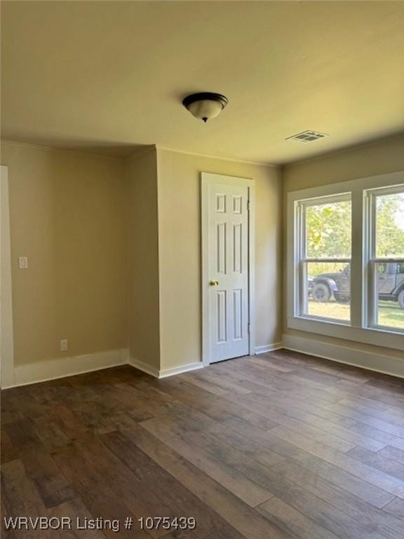 empty room featuring dark hardwood / wood-style floors