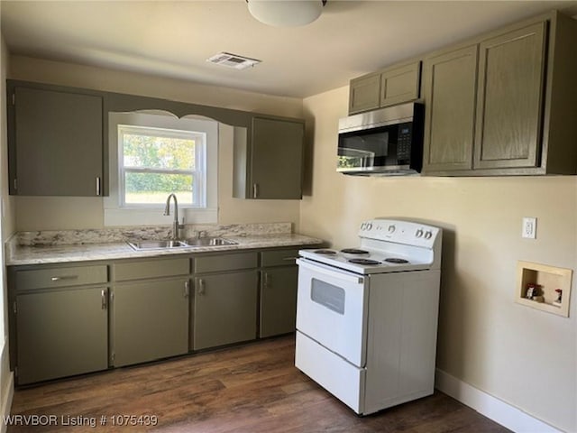 kitchen with white electric range, dark hardwood / wood-style flooring, and sink