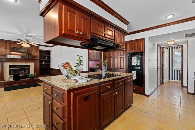 10408 Tweed Ln, Fort Smith, AR 72908 - kitchen with light tile patterned flooring, under cabinet range hood, a kitchen island, ornamental molding, and black appliances