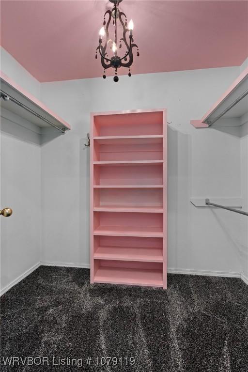 10408 Tweed Ln, Fort Smith, AR 72908 - walk in closet featuring a notable chandelier and dark carpet