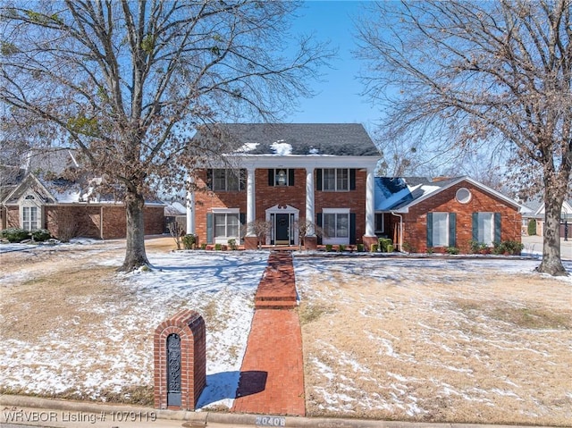 neoclassical / greek revival house with brick siding