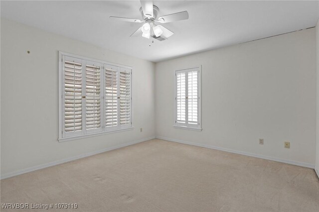 10408 Tweed Ln, Fort Smith, AR 72908 - spare room with baseboards, a ceiling fan, and light colored carpet