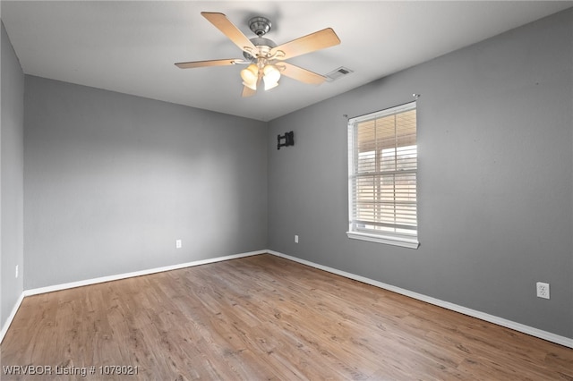 unfurnished room featuring ceiling fan and light hardwood / wood-style flooring