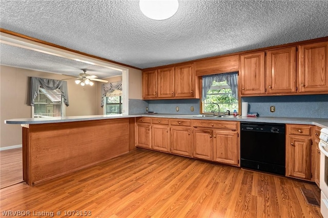 kitchen featuring kitchen peninsula, ceiling fan, sink, light hardwood / wood-style flooring, and dishwasher