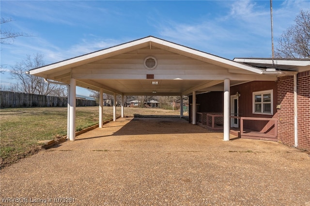 exterior space featuring concrete driveway and a carport