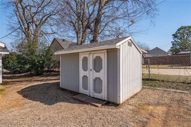 view of shed with fence
