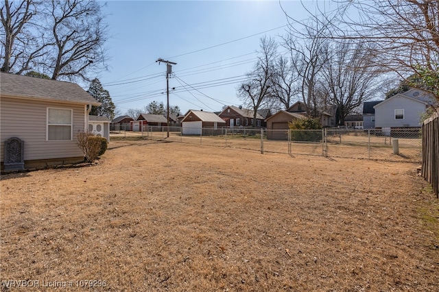 view of yard with a residential view and fence