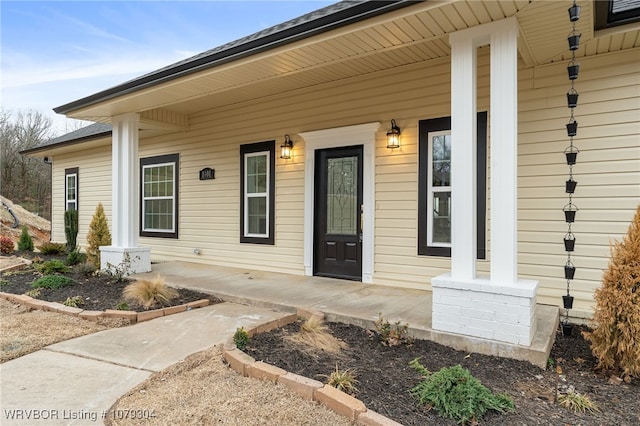 entrance to property featuring a porch