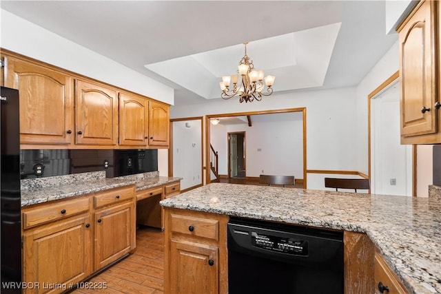 3017 Canongate Way, Fort Smith, AR 72908 - kitchen with black appliances, a chandelier, light stone counters, and light wood-style flooring