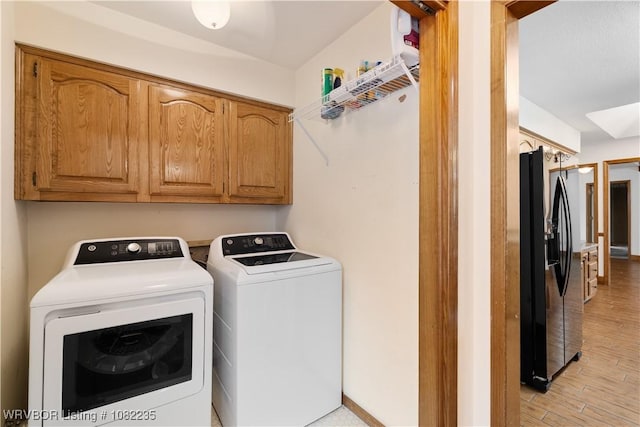 3017 Canongate Way, Fort Smith, AR 72908 - washroom with washing machine and clothes dryer, cabinet space, and light wood-style flooring