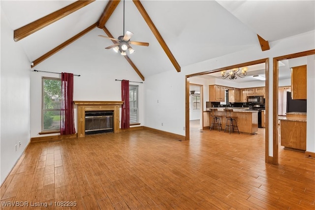 3017 Canongate Way, Fort Smith, AR 72908 - unfurnished living room with a chandelier, beamed ceiling, high vaulted ceiling, light wood-style flooring, and a glass covered fireplace