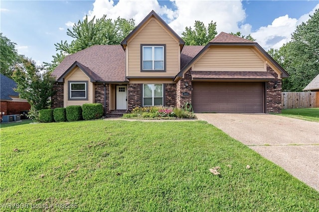 3017 Canongate Way, Fort Smith, AR 72908 - view of front facade with driveway, brick siding, an attached garage, and roof with shingles