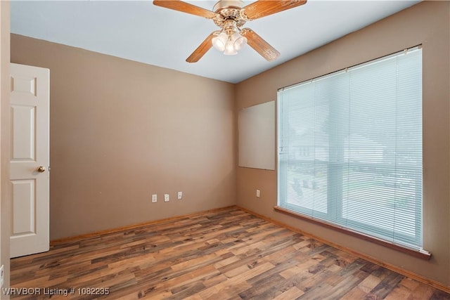 3017 Canongate Way, Fort Smith, AR 72908 - empty room with wood finished floors and ceiling fan