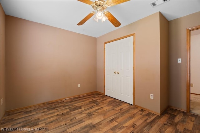3017 Canongate Way, Fort Smith, AR 72908 - unfurnished bedroom featuring wood finished floors, a closet, and a ceiling fan