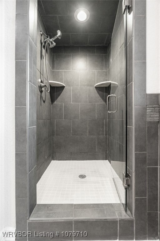full bathroom featuring a shower stall