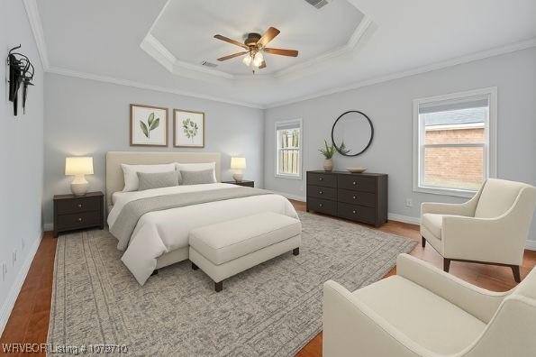 12200 Stonechase Dr, Fort Smith, AR 72916 - bedroom featuring wood finished floors, a raised ceiling, crown molding, baseboards, and a ceiling fan