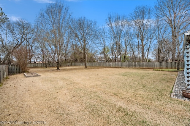 view of yard with a fenced backyard
