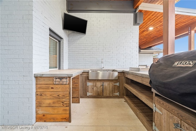 view of patio / terrace featuring area for grilling and a sink