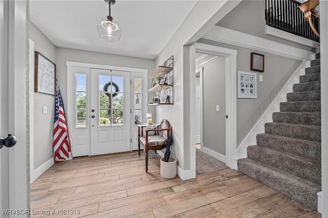 8807 Cain Rd, Alma, AR 72921 - entrance foyer featuring light wood-style flooring and stairway