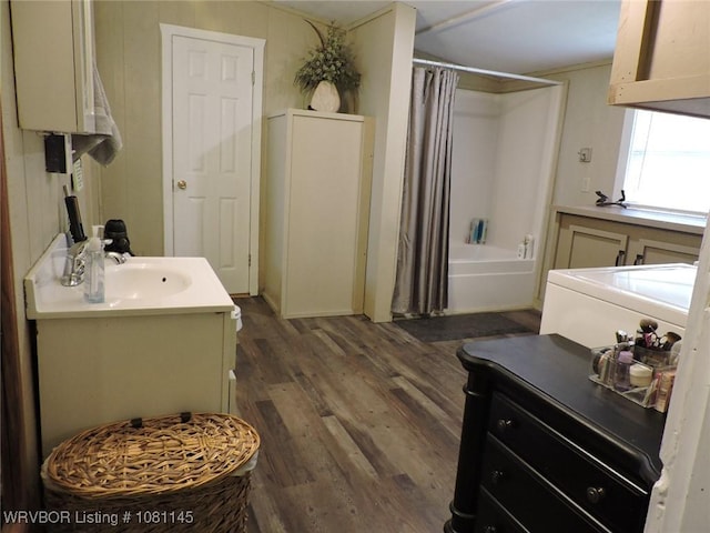 19108 Canova Trl, Mountainburg, AR 72946 - full bath featuring washer / dryer, wood finished floors, vanity, and shower / tub combo with curtain