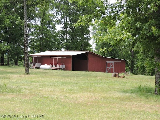 19108 Canova Trl, Mountainburg, AR 72946 - view of pole building featuring a yard