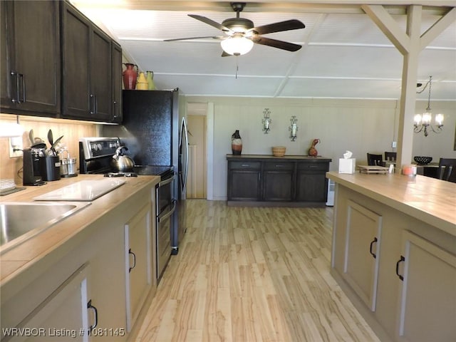 19108 Canova Trl, Mountainburg, AR 72946 - kitchen with electric range oven, light wood-style flooring, ceiling fan, dark brown cabinets, and a chandelier