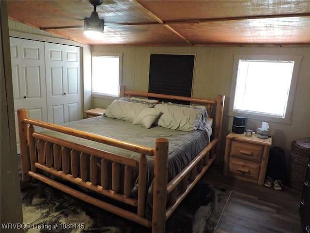 19108 Canova Trl, Mountainburg, AR 72946 - bedroom featuring multiple windows, wood finished floors, wooden ceiling, a closet, and a ceiling fan
