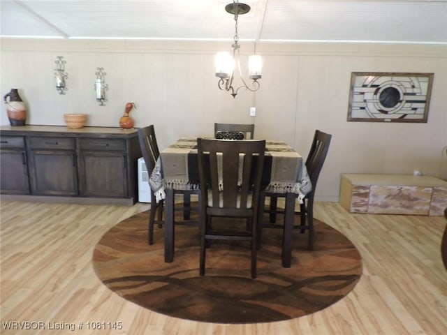 19108 Canova Trl, Mountainburg, AR 72946 - dining area featuring light wood-style floors and a chandelier