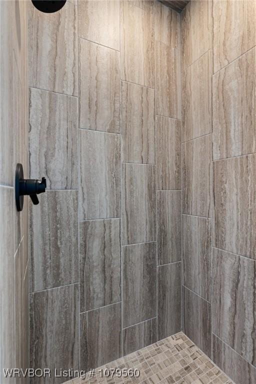 room details with a tile shower